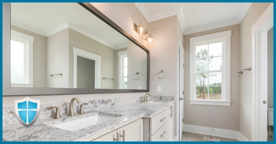 A residential bathroom with good lighting.