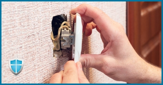 A homeowner attempting to fix a broken outlet.