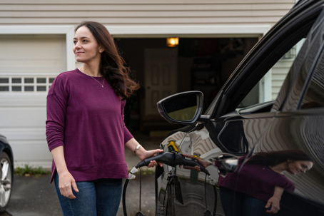 woman charging an EV