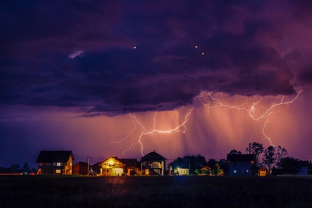 suburban home during lightning storm